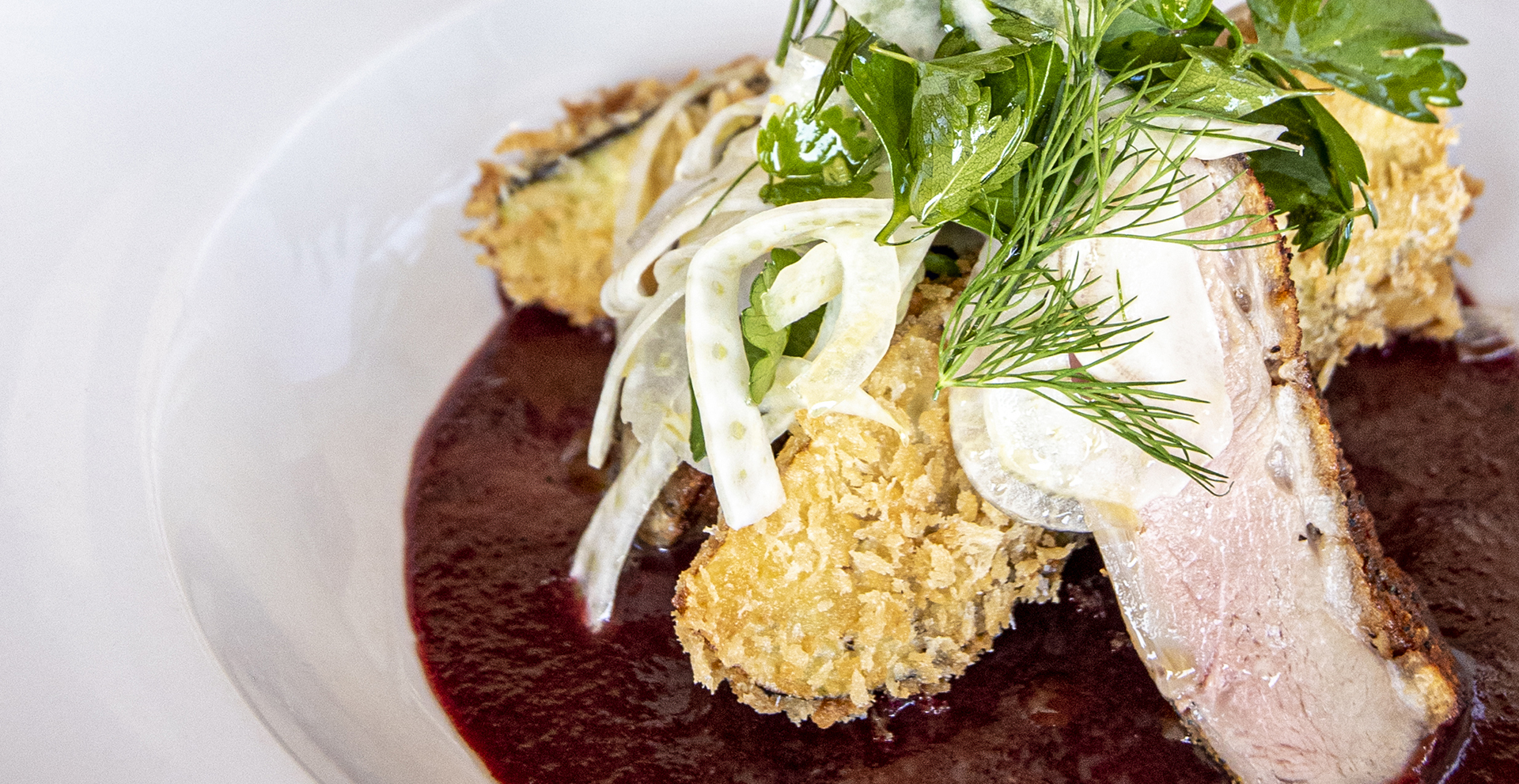 Seared Duck Breast with Fried Eggplant, a Cherry Demi-Sacue and a Fennel & Herb Salad.